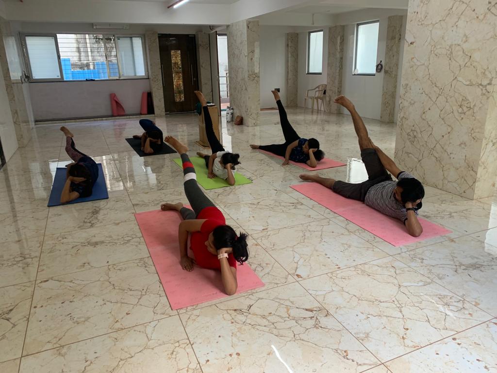 Yoga instructor guiding students in Pune